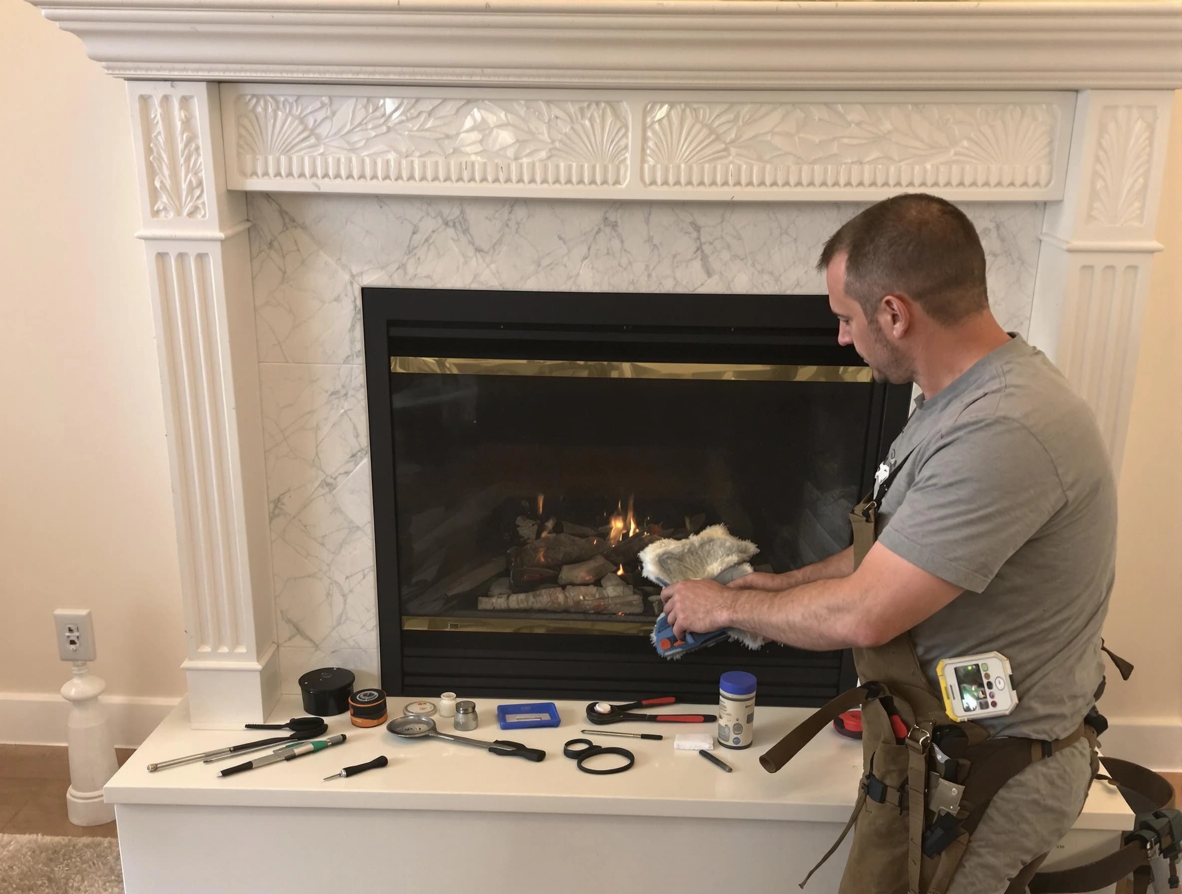 Ambridge Chimney Sweep performing fireplace maintenance in Ambridge, PA